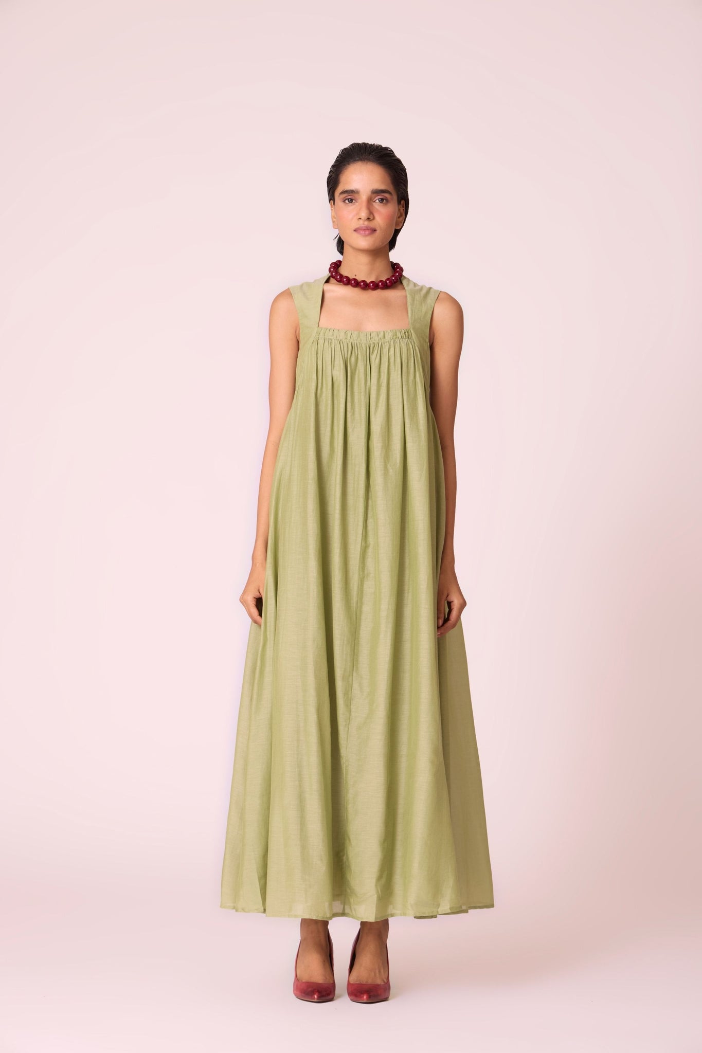 Green silk-cotton maxi dress with square neckline, full lining, in-seam pockets, and concealed side zip.