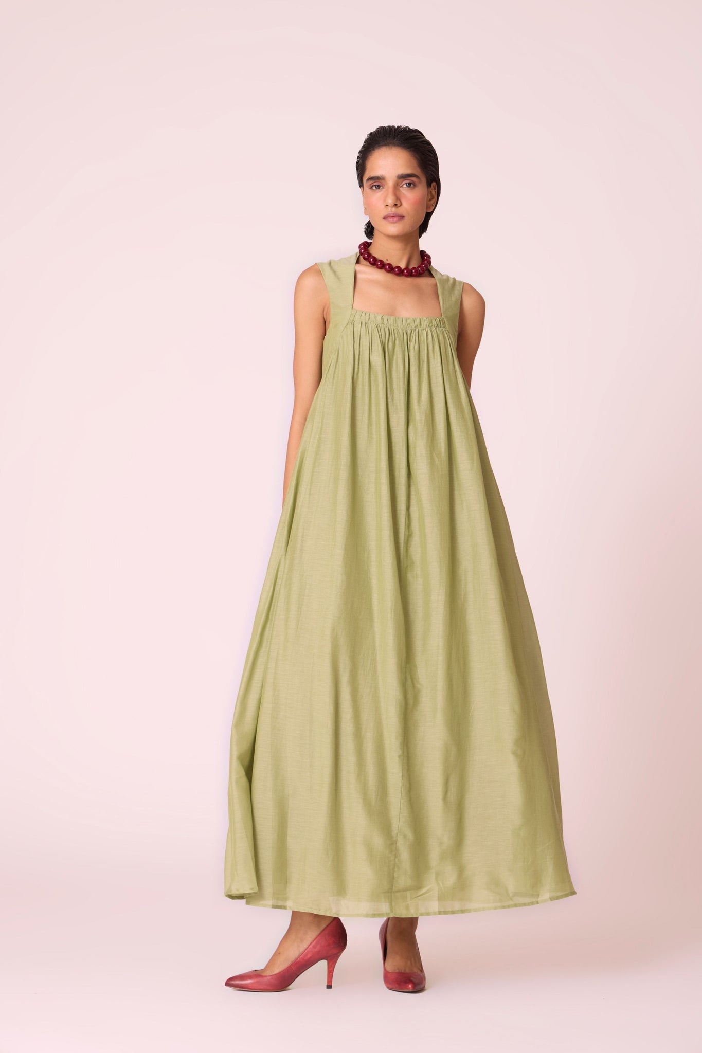 Green silk-cotton maxi dress with square neckline, full lining, in-seam pockets, and concealed side zip.