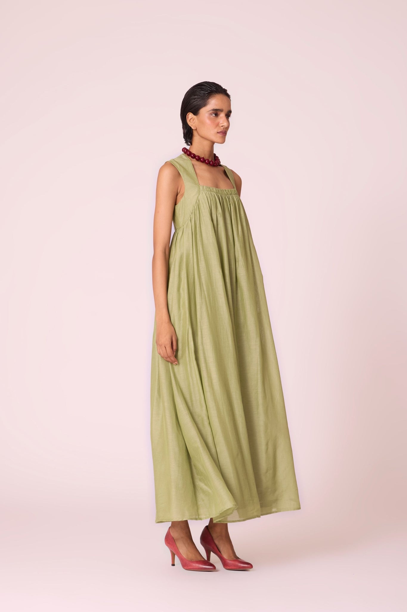 Green silk-cotton maxi dress with square neckline, full lining, in-seam pockets, and concealed side zip.