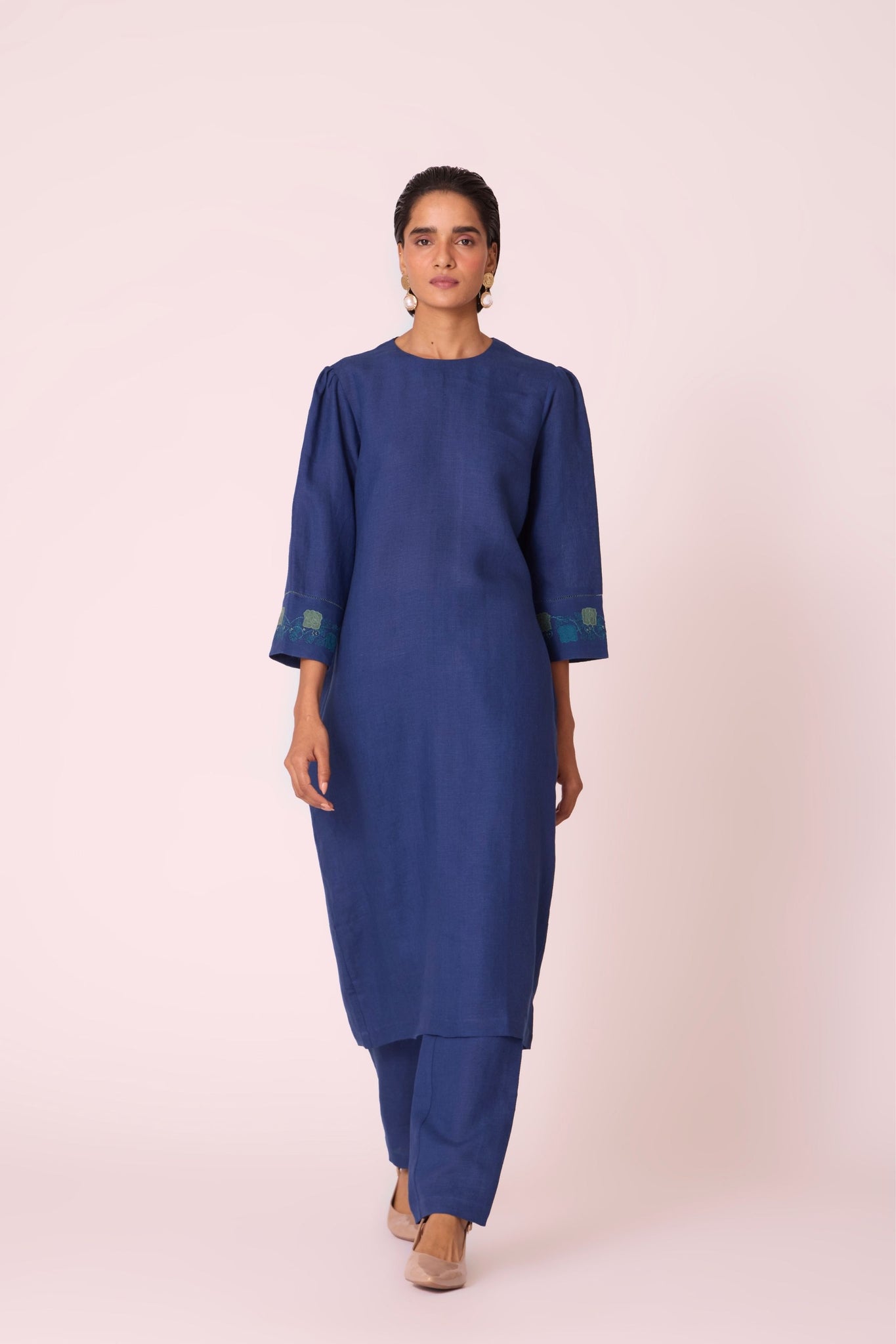 Ink blue linen tunic set with hand-embroidered 3/4 sleeves, back button tunic, and slim-fit side-zip pants.