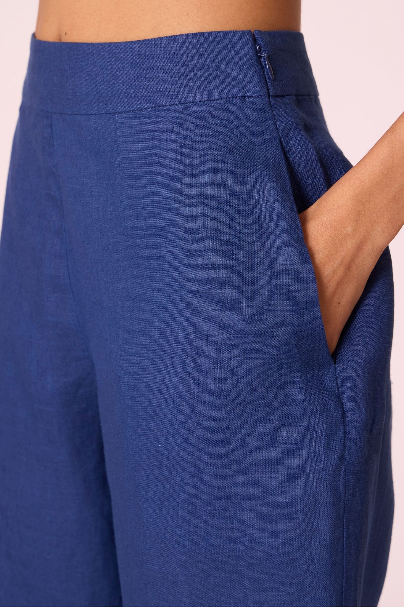 Ink blue linen tunic set with hand-embroidered 3/4 sleeves, back button tunic, and slim-fit side-zip pants.
