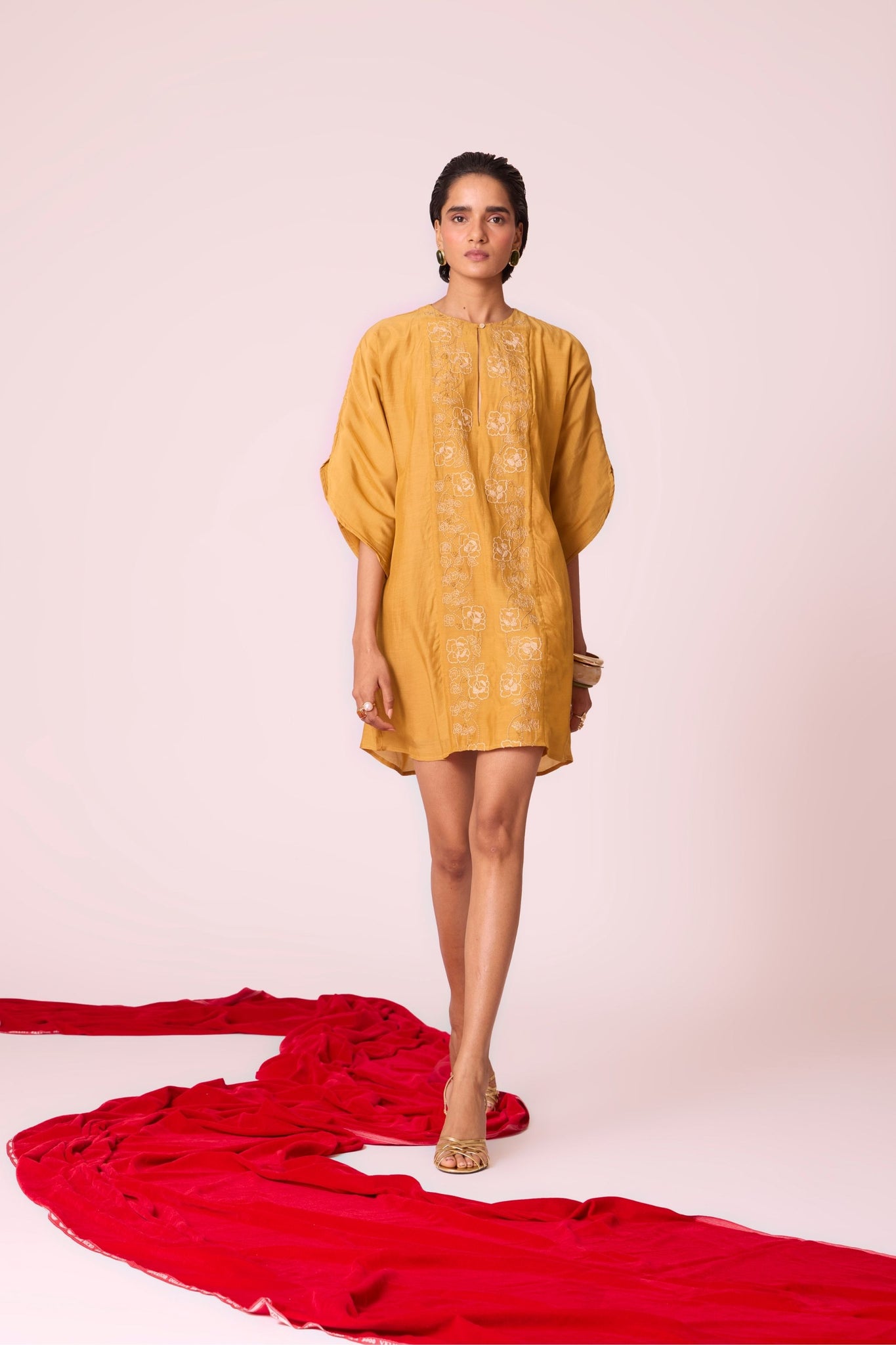 Yellow cupro dress with hand-embroidered keyhole neckline, drop sleeves, full lining, and in-seam pockets.
